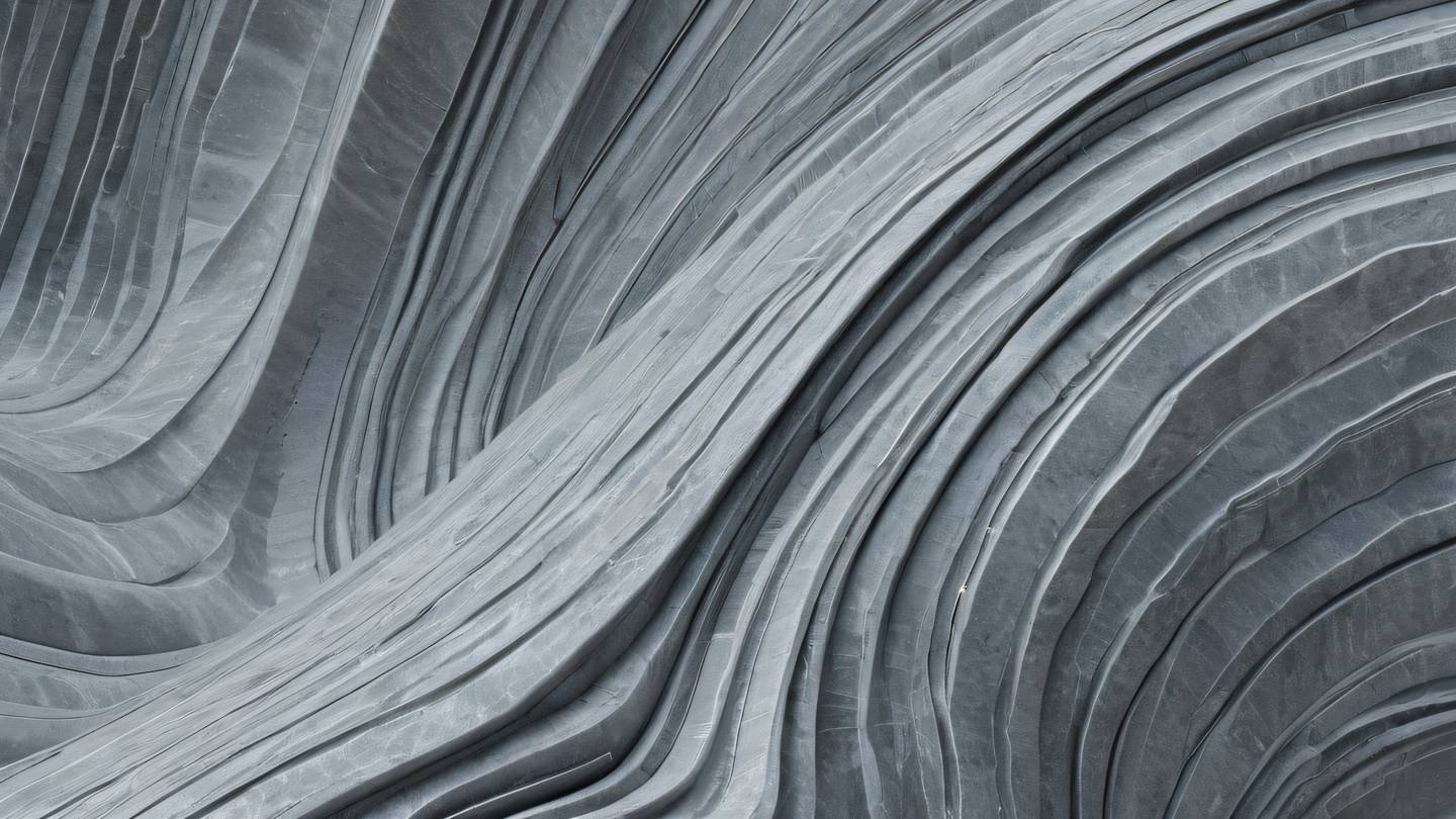An abstract stone texture sculpture showing flowing lines and geometric patterns in zinc and white colors representing the harmony of interfaces working together photographed from a dramatic upward angle high-quality ultra-realistic cinematic 8K UHD high resolution sharp and detail
